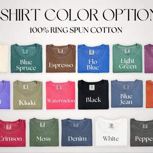 May include: Image showcasing a variety of t-shirt color options, including Ivory, Blue Spruce, Espresso, Flo Blue, Light Green, Berry, Violet, Khaki, Watermelon, Black, Blue Jean, Yam, Crimson, Moss, Denim, White, and Pepper. The text reads "T-SHIRT COLOR OPTIONS" and "100% RING SPUN COTTON."