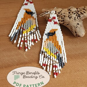 May include: A pair of beaded earrings with a geometric design. The earrings feature a white background with orange, yellow, gray, and red accents. The earrings are triangular in shape with fringe at the bottom. The earrings are made with small beads and have silver hooks. The text "Fringe Benefits Beading Co. PDF PATTERN" is visible.