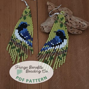 May include: A pair of beaded earrings with a blue and white bird design. The earrings are green, brown, and white. The earrings are hanging from silver hooks. The image also includes the text "Fringe Benefits Beading Co. PDF PATTERN".