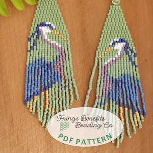 May include: A pair of green, blue, and yellow beaded earrings with a bird design. The earrings are long and dangle. The earrings are labeled "Fringe Benefits Beading Co. PDF Pattern".