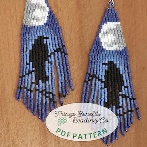 May include: A pair of blue, white and black beaded earrings with fringe. The earrings are in the shape of a teardrop and have a white circle in the centre. The earrings are labelled "Fringe Benefits Beading Co. PDF Pattern".