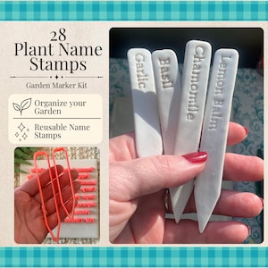 May include: A set of 28 plant name stamps for a garden marker kit. The kit includes white, pointed plant markers embossed with the text Garlic, Basil, Chamomile, and Lemon Balm, alongside bright orange plastic stamp outlines for creating labels.