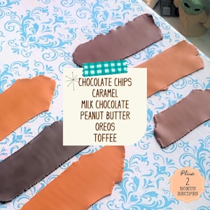 May include: Five different coloured pieces of fondant, each with a different flavour listed on a card: chocolate chips, caramel, milk chocolate, peanut butter, Oreos, and toffee. Plus 2 bonus recipes.