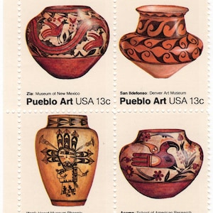 May include: A sheet of four postage stamps featuring Pueblo art pottery. Each stamp showcases a different vase design with intricate patterns and colors, including red, brown, and orange. The stamps are labeled "Pueblo Art USA 13c" with museum names.