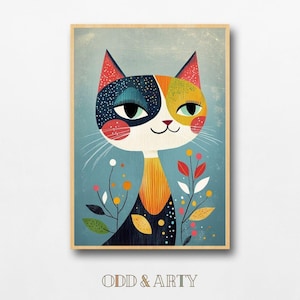 Könnte beinhalten: Ein gerahmter Kunstdruck mit einer skurrilen Katzenillustration. Die Katze hat ein farbenfrohes Gesicht mit blauen, orangefarbenen und gelben Abschnitten. Es ist vor einem hellblauen Hintergrund mit floralen Akzenten und dem Text "ODD & ARTY" unten platziert.
