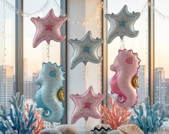 Juego de 3 globos con temática oceánica: caballito de mar y estrella de mar, en rosa y azul, ideales para decorar fiestas bajo el mar.