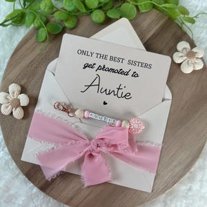 Annonce future tante tante grossesse enceinte bébé bébé parents soeur amie cousine surprise porte-clés
