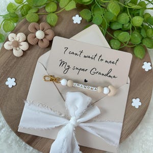 Annuncio alla futura nonna, gravidanza, bambino incinta, genitori, nonni, portachiavi a sorpresa