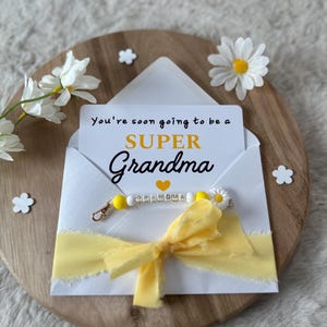 Annuncio alla futura nonna, gravidanza, bambino incinta, genitori, nonni, portachiavi a sorpresa