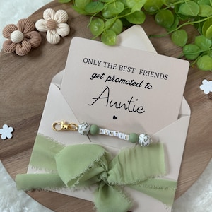 Annonce future tante tante grossesse enceinte bébé bébé parents soeur amie cousine surprise porte-clés