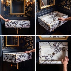 May include: A rectangular wall-mounted bathroom sink crafted from white marble with prominent dark purple and black veining. The basin features a flat top surface, a central drain hole, and a secondary overflow hole, paired with a gold-toned metal drain pipe.