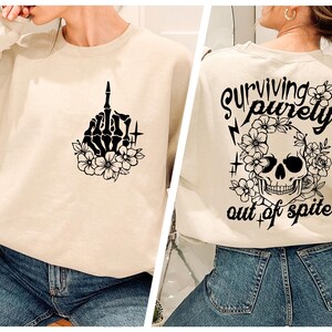 Surviving Purely Out Of Spite Sweatshirt, Halloween Sweatshirt, Funny Skeleton Hoodie, Floral Skull Crewneck, Spooky Season Sweatshirt
