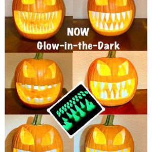 May include: A collage of carved orange pumpkins featuring various sets of white plastic teeth inserts. The text reads NOW Glow-in-the-Dark. A central inset shows the teeth glowing green in the dark. The pumpkins have triangular eyes and wide mouths.