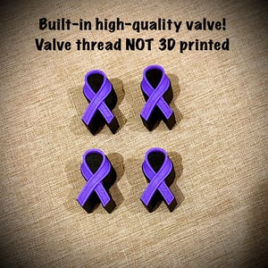 May include: Four purple awareness ribbon charms with black bases. The text above reads: Built-in high-quality valve! Valve thread NOT 3D printed. Each ribbon features a textured surface and a loop design, arranged in a two-by-two grid pattern.