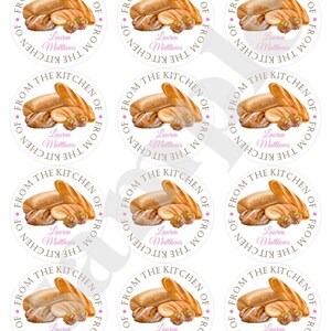 May include: Nine white round stickers with a brown watercolor illustration of various breads and the text "From the Kitchen of Lauren Matthews" in brown and pink.