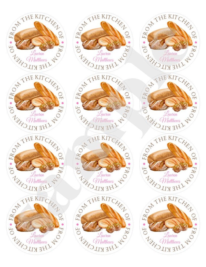 May include: Nine white round stickers with a brown watercolor illustration of various breads and the text "From the Kitchen of Lauren Matthews" in brown and pink.