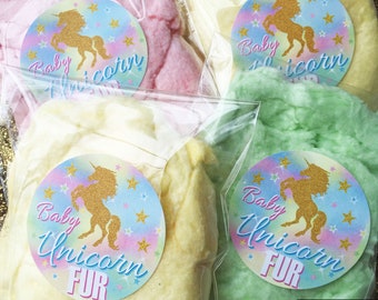 May include: Three bags of cotton candy with colorful unicorn stickers that say "Baby Unicorn Fur".
