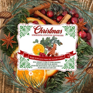 May include: A white label with green and red decorative borders and the text "Christmas Simmering Stovetop Potpourri Made with Love from the Taylor Family Add all ingredients to a small pot or mini slow cooker. Add water and simmer on low, uncovered. Add additional water as needed. A hint of vanilla is nice also! The scent should last a couple days."
