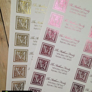 May include: A sheet of return address labels with a gold and burgundy monogram design. The labels feature the text "The Matthews Family" and the address "3454 Eden Cliff Trail, Anytown, Ohio 44543".