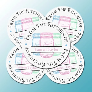 May include: Four round white stickers with black text that reads "From the Kitchen of" and a graphic of three mason jars with handwritten text that reads "Homemade" on each jar. The jars are in pink, blue, and green.