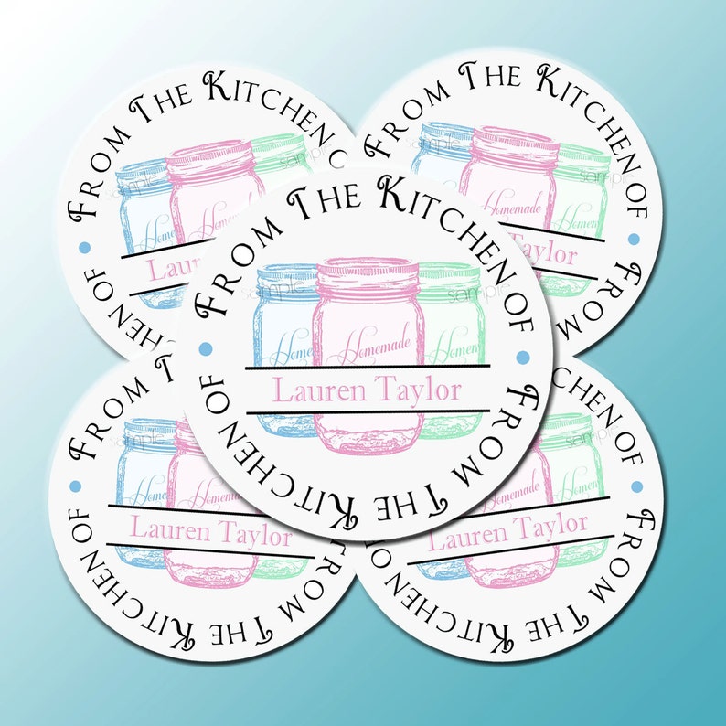 May include: Four round white stickers with black text that reads "From the Kitchen of" and a graphic of three mason jars with handwritten text that reads "Homemade" on each jar. The jars are in pink, blue, and green.