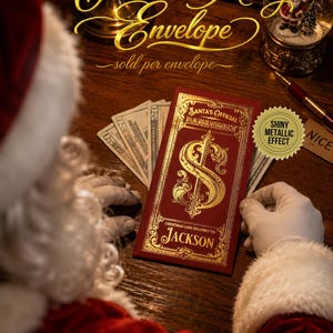 May include: A rectangular red Christmas money envelope featuring gold metallic foil accents. The text reads Santa's Official Bank Vault and Christmas Cash Delivery To: Jackson. A dollar sign is centered on the front with ornate decorative borders.