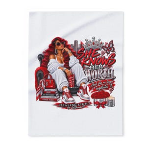 May include: A white graphic print featuring a person with long red hair wearing sunglasses, a white sweatsuit, and red and white sneakers. The text reads: She Knows Her Worth And she no longer negotiates it. Includes a crown, red roses, and books.