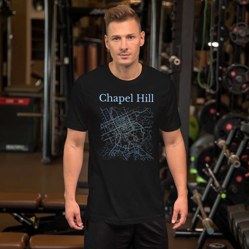 May include: Black t-shirt with a blue outline map of Chapel Hill, North Carolina.