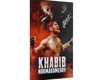 May include: A poster featuring a mixed martial arts fighter, Khabib Nurmagomedov, with his signature in the top right corner. The poster has a red, orange, and yellow background with the fighter's name in white text.