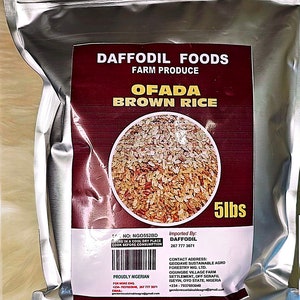 May include: A silver foil bag of Ofada brown rice from Daffodil Foods, with a label displaying the product name and a circular image of the rice. The bag contains 5 lbs of rice and includes text about storage and origin.