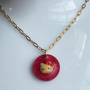 The Hello Kitty Black and Fine Silver Glitter Resin Charm