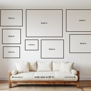 Size chart showing various dimensions of framed art prints above a white sofa, helping visualize the scale of different print sizes. Sofa size is 85 inches.
