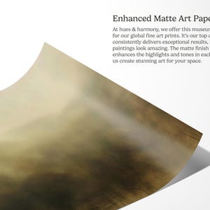 May include: A close-up of a textured, matte art paper with a subtle, faded, brown and green color gradient. The paper is slightly curled at the bottom right corner. The text "Enhanced Matte Art Paper" is visible at the top of the image.