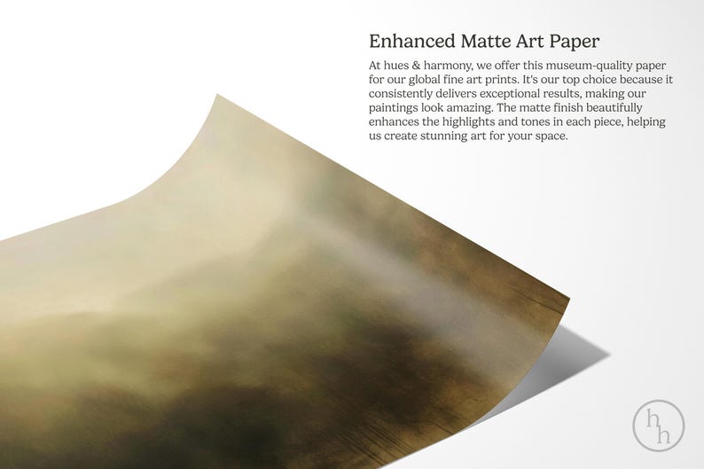 May include: A close-up of a textured, matte art paper with a subtle, faded, brown and green color gradient. The paper is slightly curled at the bottom right corner. The text "Enhanced Matte Art Paper" is visible at the top of the image.