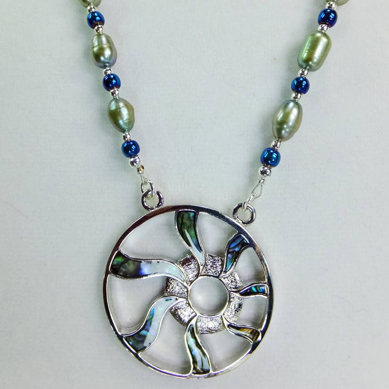 Abalone Shell Inset Sun Ray Pendant with Pale Green Freshwater Pearls, Blue Glass Beads and Tiny Silver Plated Spacer Beads Necklace image 1