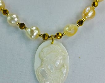Cameo Carved into White Shell Necklace with Freshwater Pearls and Tiny Cut Glass Beads with tiny Gold Plated Spacer Beads Necklace