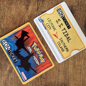 May include: Two Eon Tickets for the S.S. Tidal, a ferry to Southern Island. The ticket is for the Ruby and Sapphire versions of Pokemon. The ticket is yellow with black text and a blue and red background.
