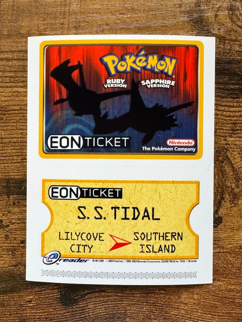 May include: A yellow and white Eon Ticket for the Pokemon Ruby and Sapphire video games. The ticket is for travel on the S.S. Tidal from Lilycove City to Southern Island.