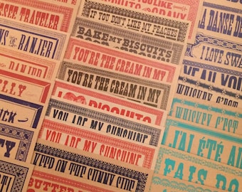 May include: A collection of colorful vintage-style signs with various sayings, including "I Love You Like Digoleto", "You're the Cream in My Digoleto", "You Are My Sunshine", "Butter My Butt & Call Me Biscuit", "If You Don't Like My Peaches Bake My Biscuits", "The Fiddler A Dram", "See Traveler", "Sons of Ranier", "Gumboot", "A Dance De", "I Love Swa", "V'fall Vol", "Whippy Prop", "J'ai Été Al", "Fais Do".