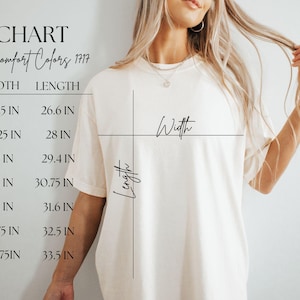 May include: Cream-colored t-shirt with a size chart. The chart lists sizes S to 4XL, with width and length measurements in inches. The text "Unisex Comfort Colors 177" is at the top.