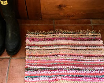 Country chic small handmade rag rug, table mat, in shades of pink