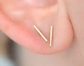 Dainty 9.5mm long bar line stud earrings in brass and sterling silver for minimalist men or women with multiple piercings