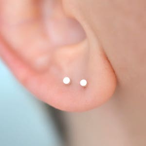 Pair of 2mm circle dot stud earrings in solid sterling silver for minimalist men or women snake bite ear piercing image 1