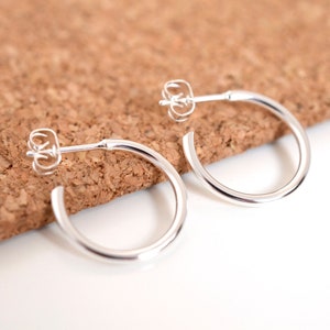 Simple silver sterling hoop earrings in two different sizes for men or women
