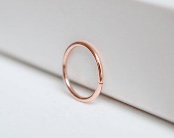 Solid 14k rose gold sleeper hoop earrings with a 9mm inner diameter for earlobe or cartilage