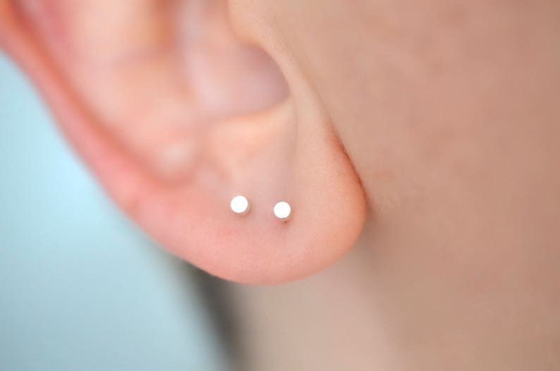 Pair of 2mm circle dot stud earrings in solid sterling silver for minimalist men or women snake bite ear piercing image 1