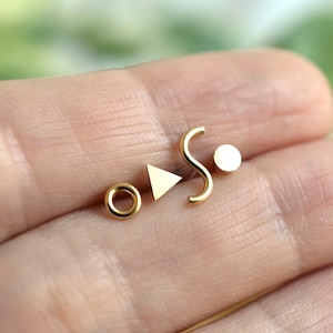 Mismatched geometric set of Memphis inspired triangle, squiggle, dot and donut sterling silver stud earrings for minimalist men or women Brass