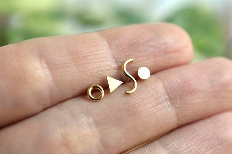 Mismatched geometric set of Memphis inspired triangle, squiggle, dot and donut sterling silver stud earrings for minimalist men or women Brass