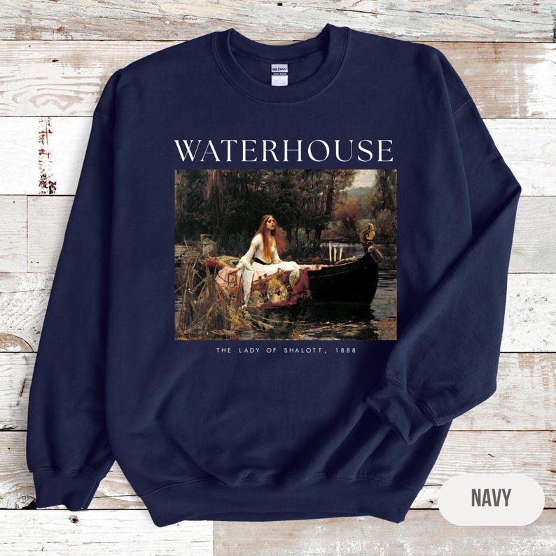 May include: Navy blue sweatshirt with a print of John William Waterhouse's painting "The Lady of Shalott" and the text "WATERHOUSE" and "THE LADY OF SHALOTT, 1888".