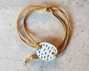 Adjustable bracelet with handmade porcelain bead